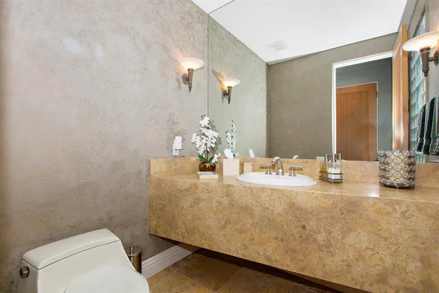 a bedroom with a bed couch and window