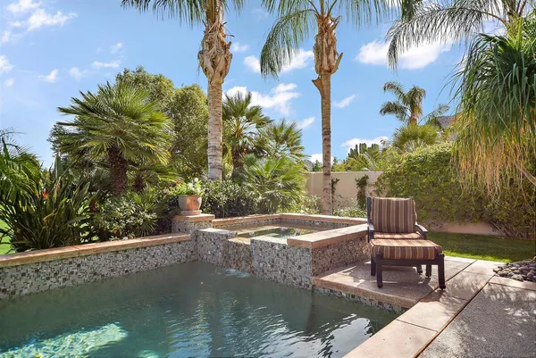 a view of a patio with swimming pool