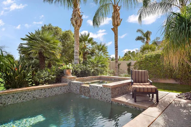 a view of a patio with swimming pool