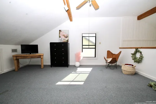 a room with furniture and a window