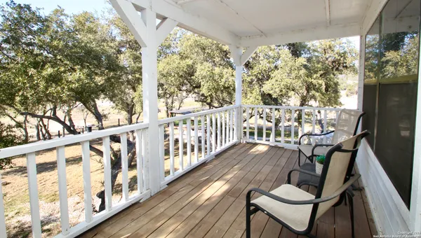 a view of balcony with furniture