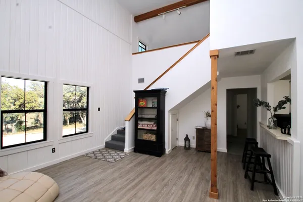 a view of a dining room with furniture and wooden floor