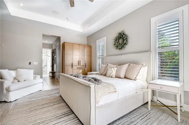 a large white bed in a white room