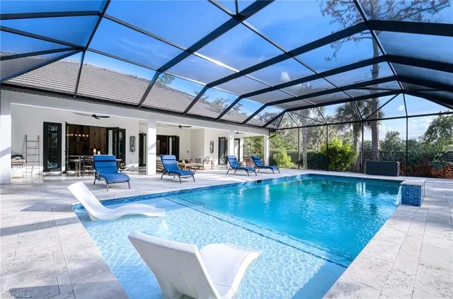 a view of a swimming pool with a patio