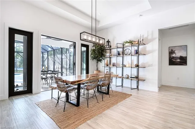 a dining room with furniture and wooden floor