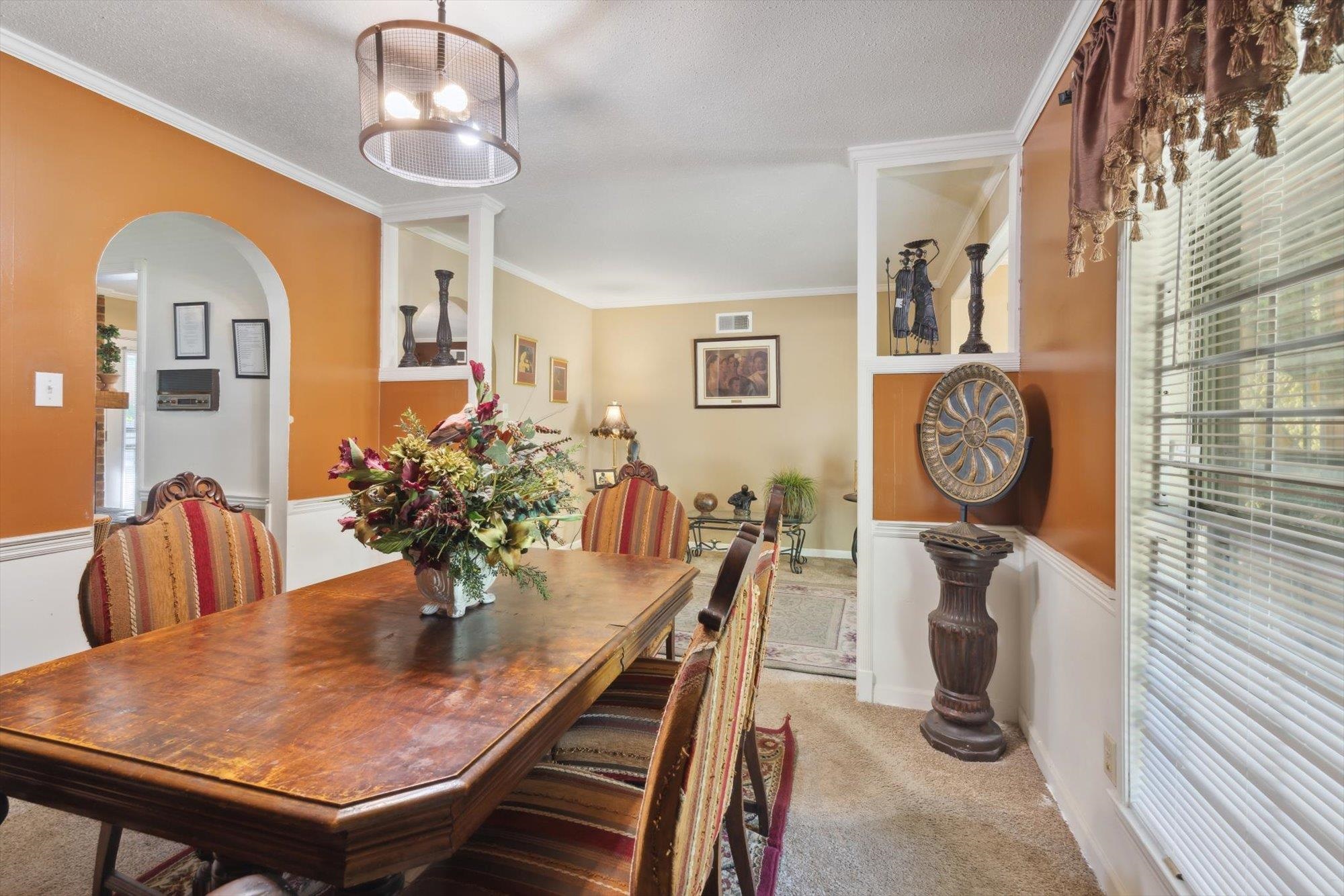 2936 Falkirk Road Memphis, TN 38128 - Photo 20 of 25 a view of a dining room with furniture and a chandelier