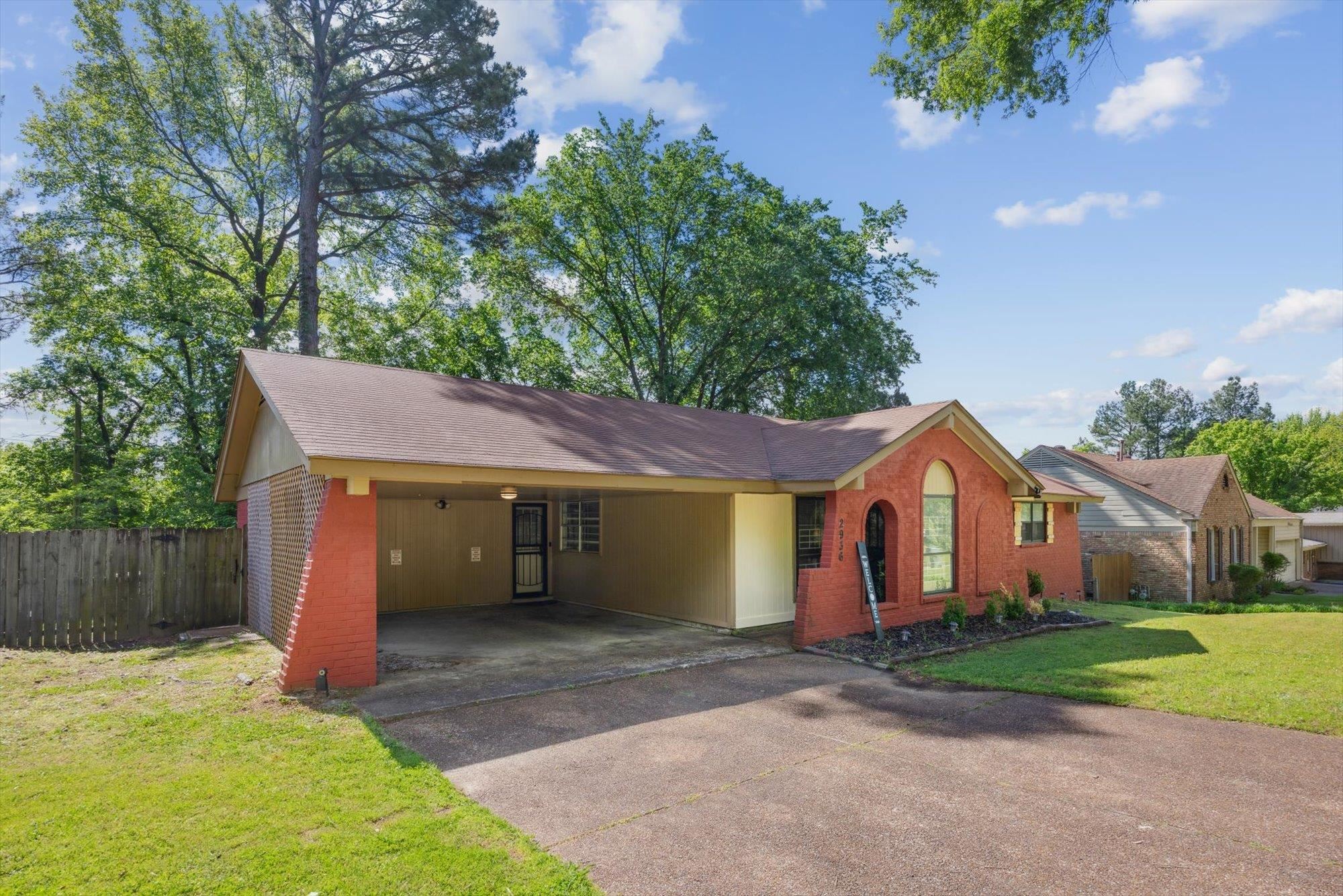 2936 Falkirk Road Memphis, TN 38128 - Photo 2 of 25 a view of a house with a yard and large tree