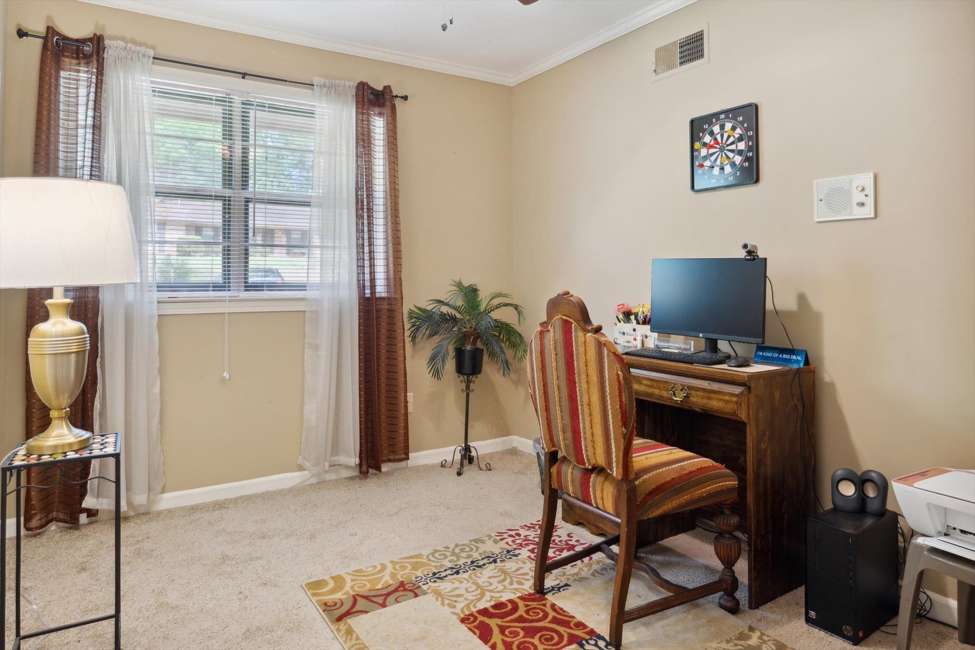 2936 Falkirk Road Memphis, TN 38128 - Photo 7 of 25 a view of a workspace with furniture and a window