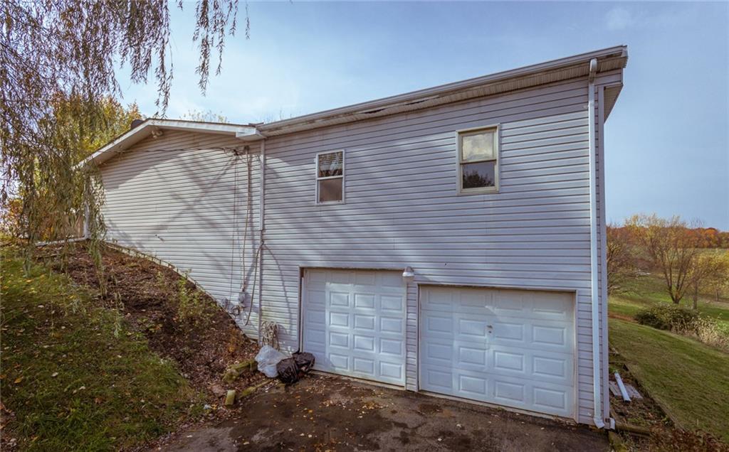 951 Achortown Road Beaver Falls, PA 15010 - Photo 4 of 21 Two extra large garages with one tall door. The third garage is around the corner.