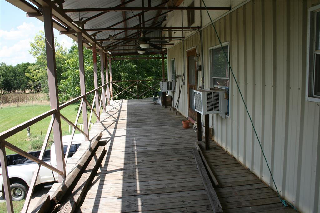 430 Rio Road Millsap, TX 76066 - Photo 8 of 25 Deck with a yard and ceiling fan