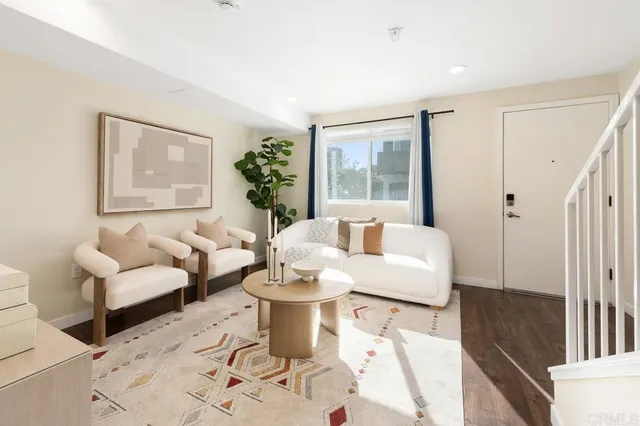 a living room with furniture and a large window