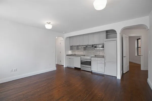 a view of kitchen with wooden floor