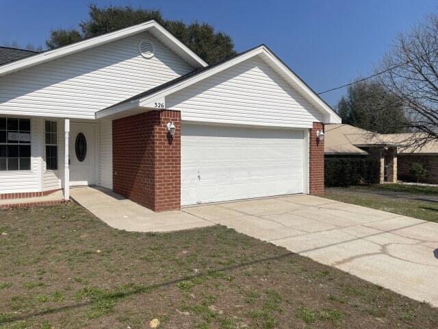 326 Riverchase Boulevard Crestview, FL 32536 - Photo 20 of 24 a front view of a house with a yard