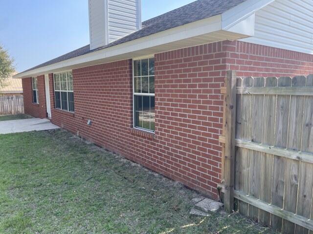 326 Riverchase Boulevard Crestview, FL 32536 - Photo 21 of 24 a brick building with a yard