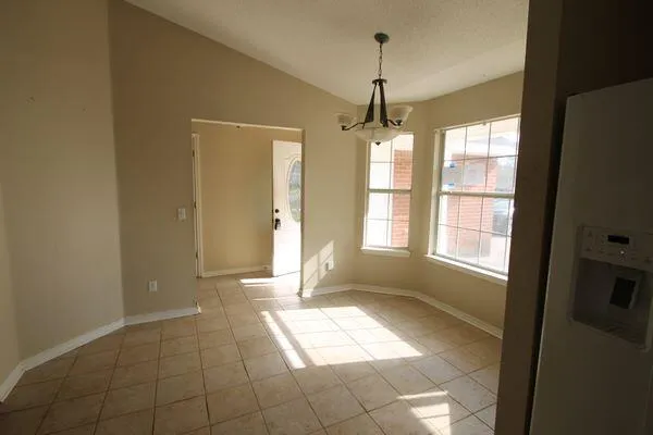 a view of entryway with window and chandelier