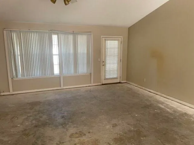 an empty room with windows