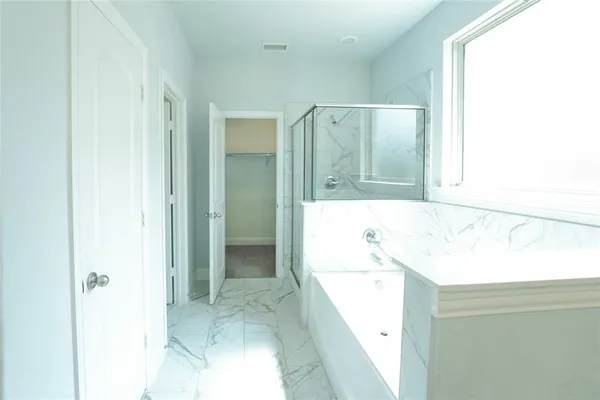a view of a hallway with staircase