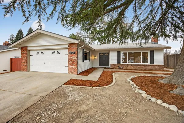a view of a house with a yard