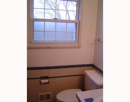 5010 Windriver Drive McKees Rocks, PA 15136 - Photo 6 of 11 Master Bath/Spa. Conjoined bathrooms with a shower, tub, and two commodess