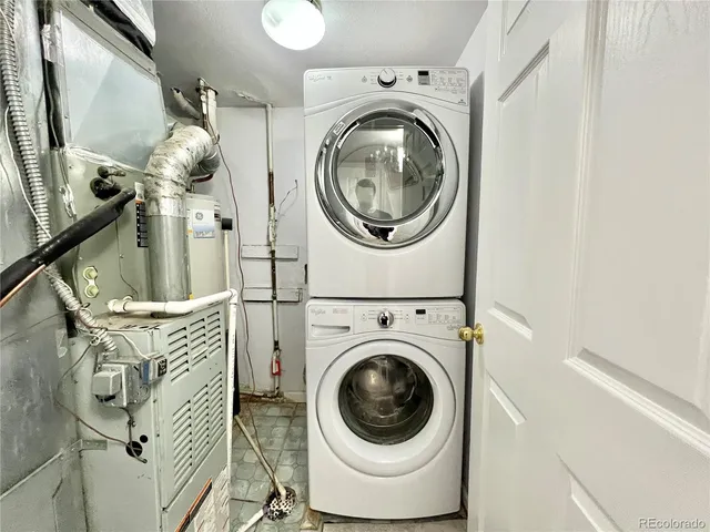 a close view of a utility room with dryer and washer