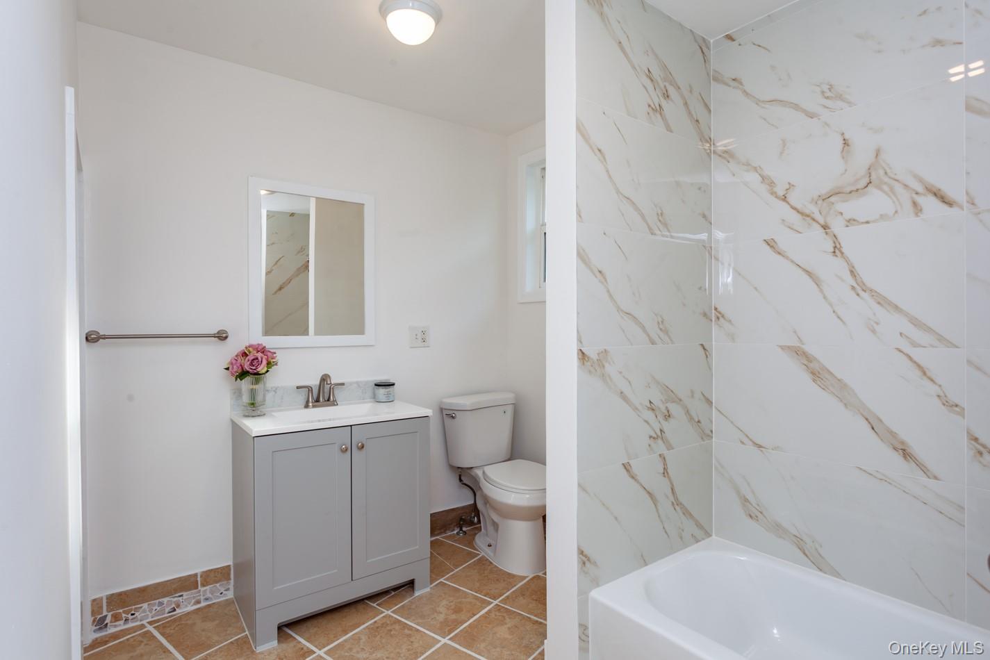 89 Smith Street Poughkeepsie, NY 12601 - Photo 26 of 42 a bathroom with a sink toilet and shower