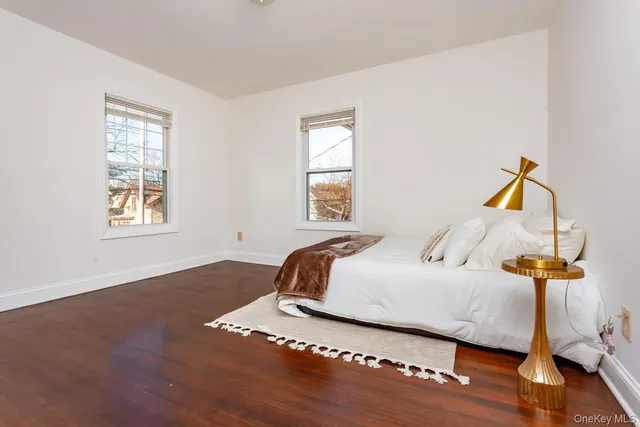 a bedroom with bed and window