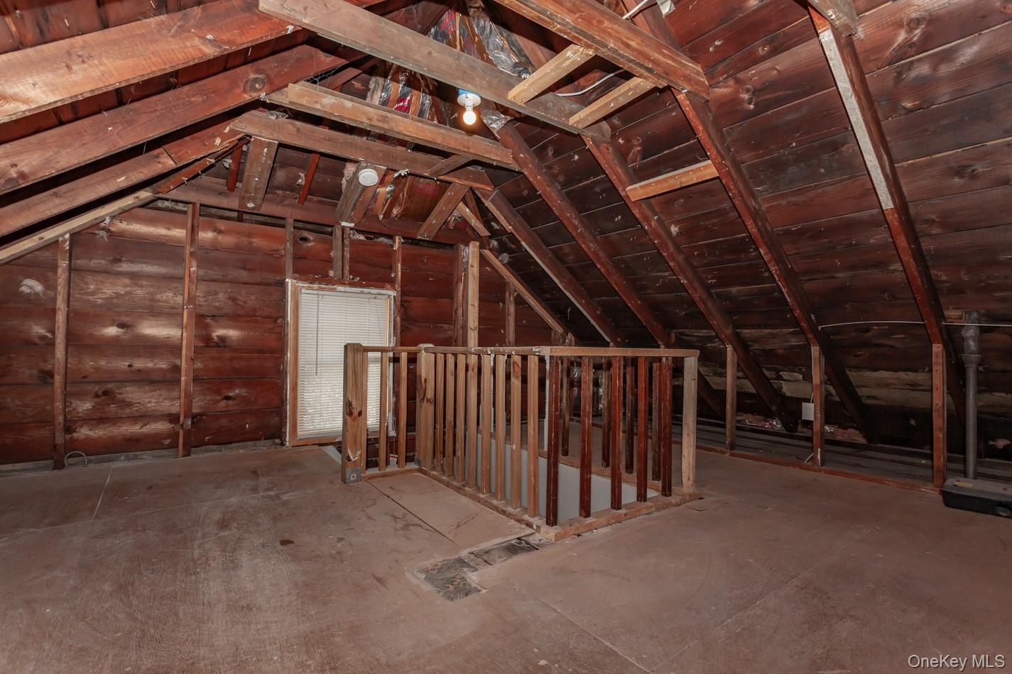 89 Smith Street Poughkeepsie, NY 12601 - Photo 34 of 42 a view of an empty room with wooden walls