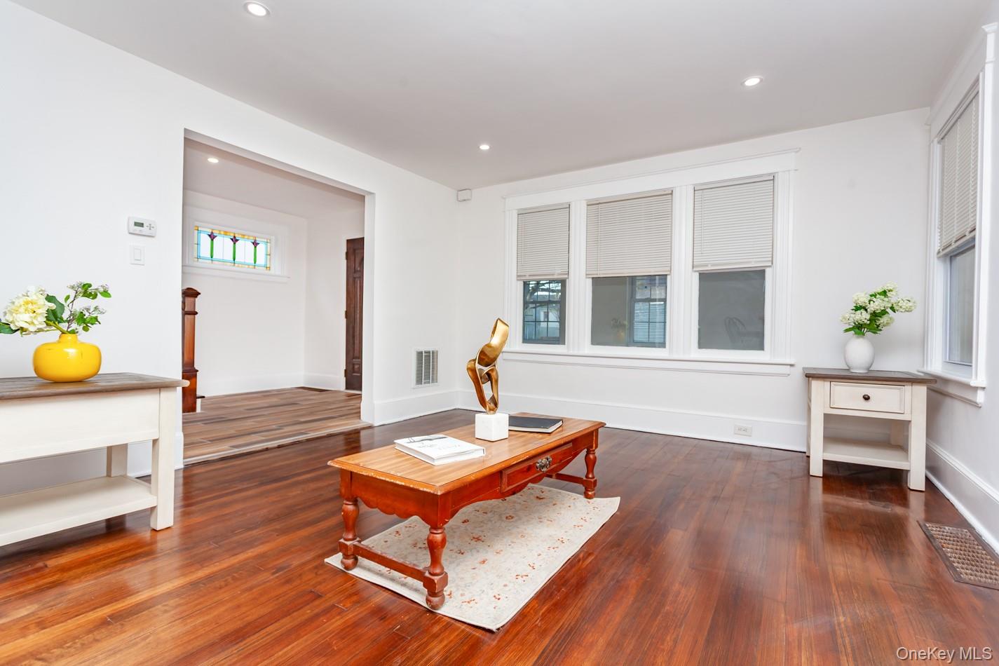 89 Smith Street Poughkeepsie, NY 12601 - Photo 7 of 42 a living room with furniture and a wooden floor