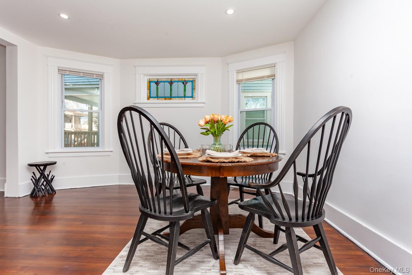89 Smith Street Poughkeepsie, NY 12601 - Photo 10 of 42 a view of a dining room with furniture window and wooden floor