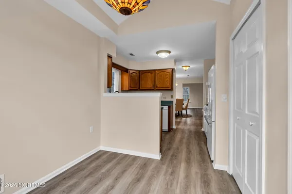 a view of a livingroom with wooden floor