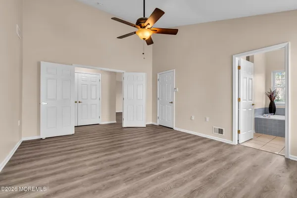a view of an empty room with a bathroom