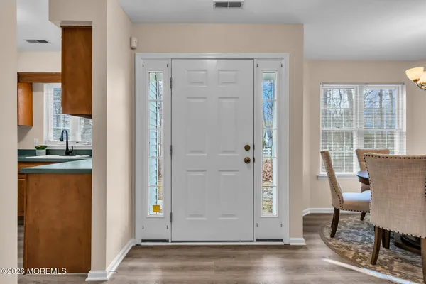 a view of a dining room with furniture and a window