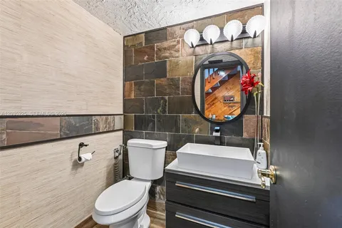 a bathroom with a toilet and a sink