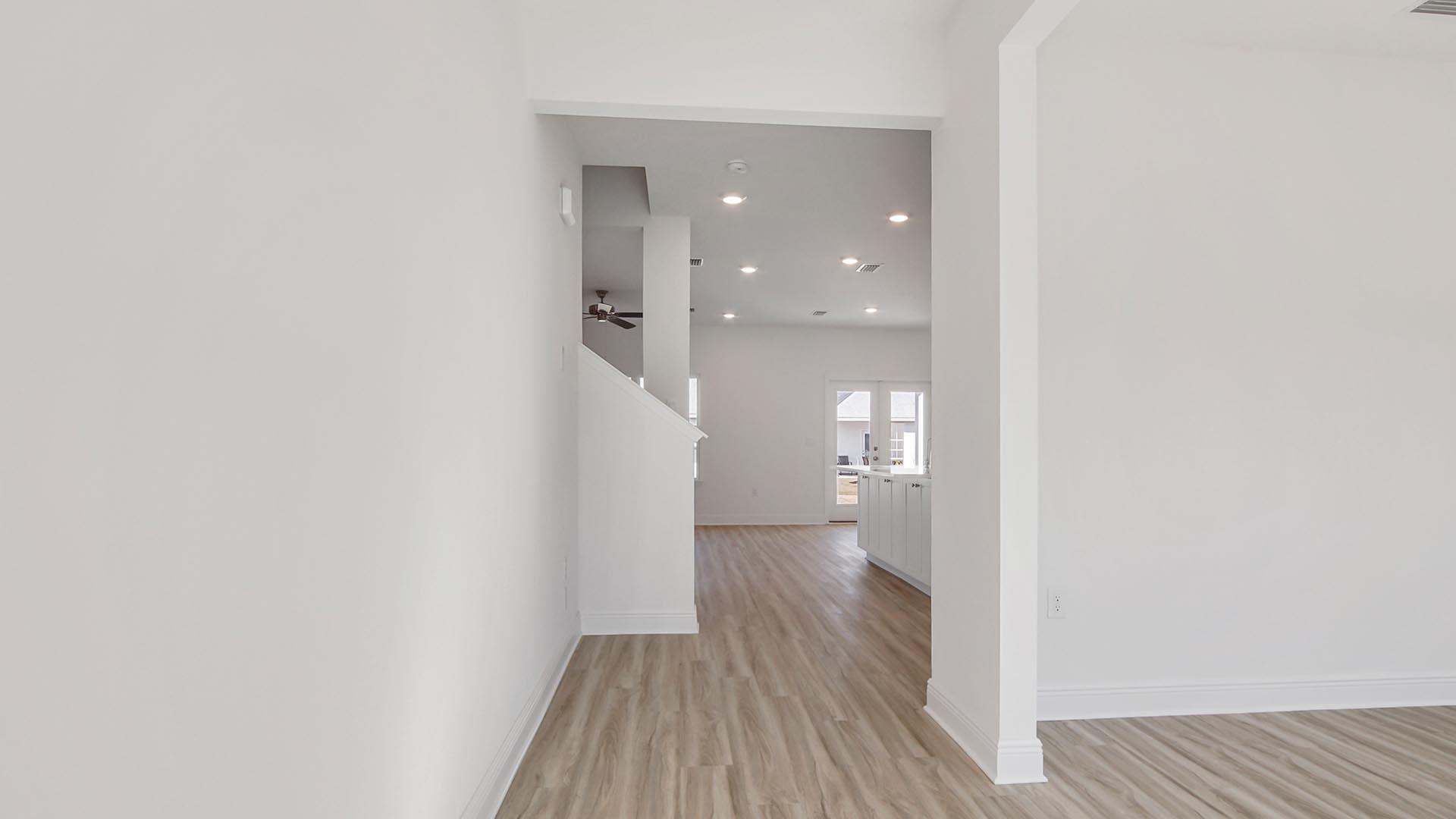 373 Holley Grv Lane Santa Rosa Beach, FL 32459 - Photo 2 of 46 a view of a hallway with wooden floor