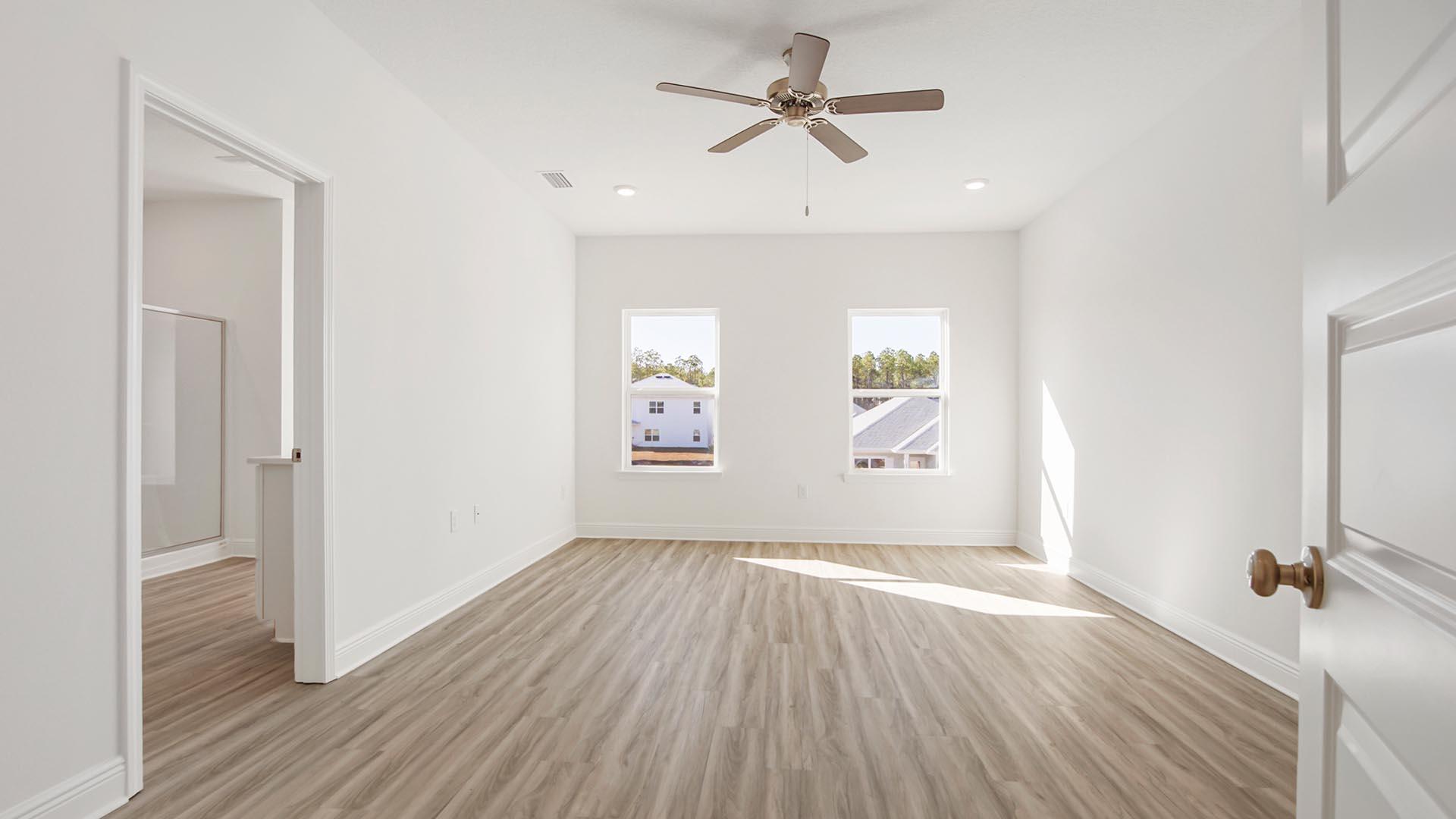 373 Holley Grv Lane Santa Rosa Beach, FL 32459 - Photo 22 of 46 wooden floor in an empty room with a window