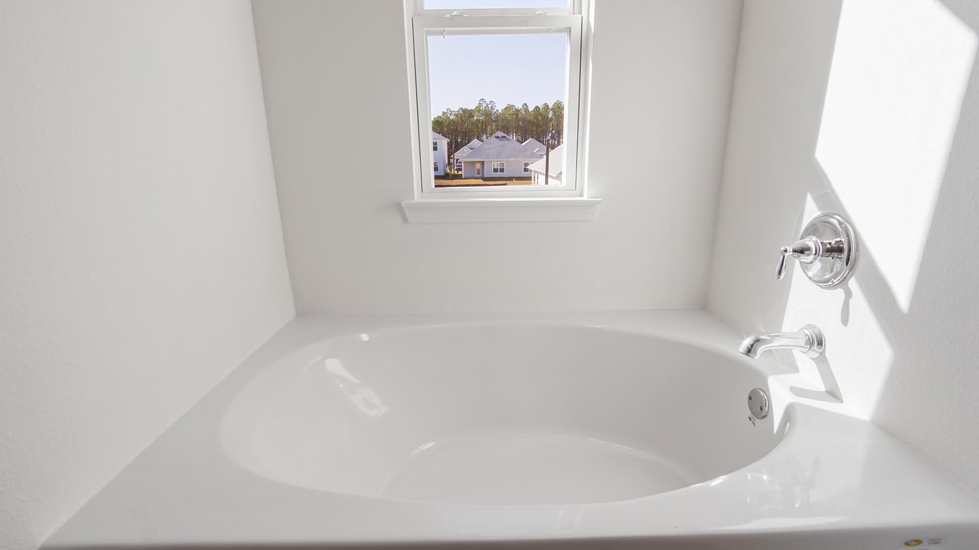 373 Holley Grv Lane Santa Rosa Beach, FL 32459 - Photo 28 of 46 a white bath tub sitting in a bathroom