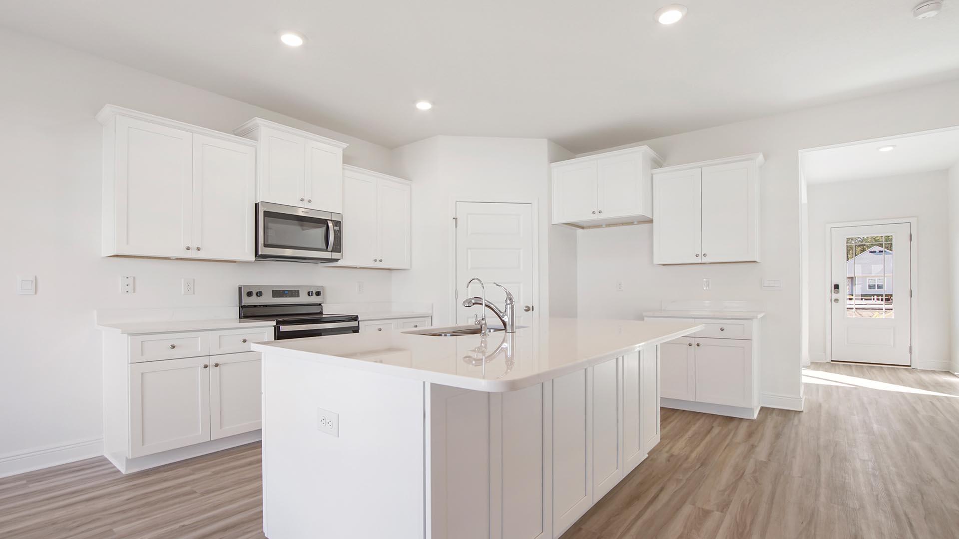 373 Holley Grv Lane Santa Rosa Beach, FL 32459 - Photo 6 of 46 a kitchen with appliances a sink and cabinets