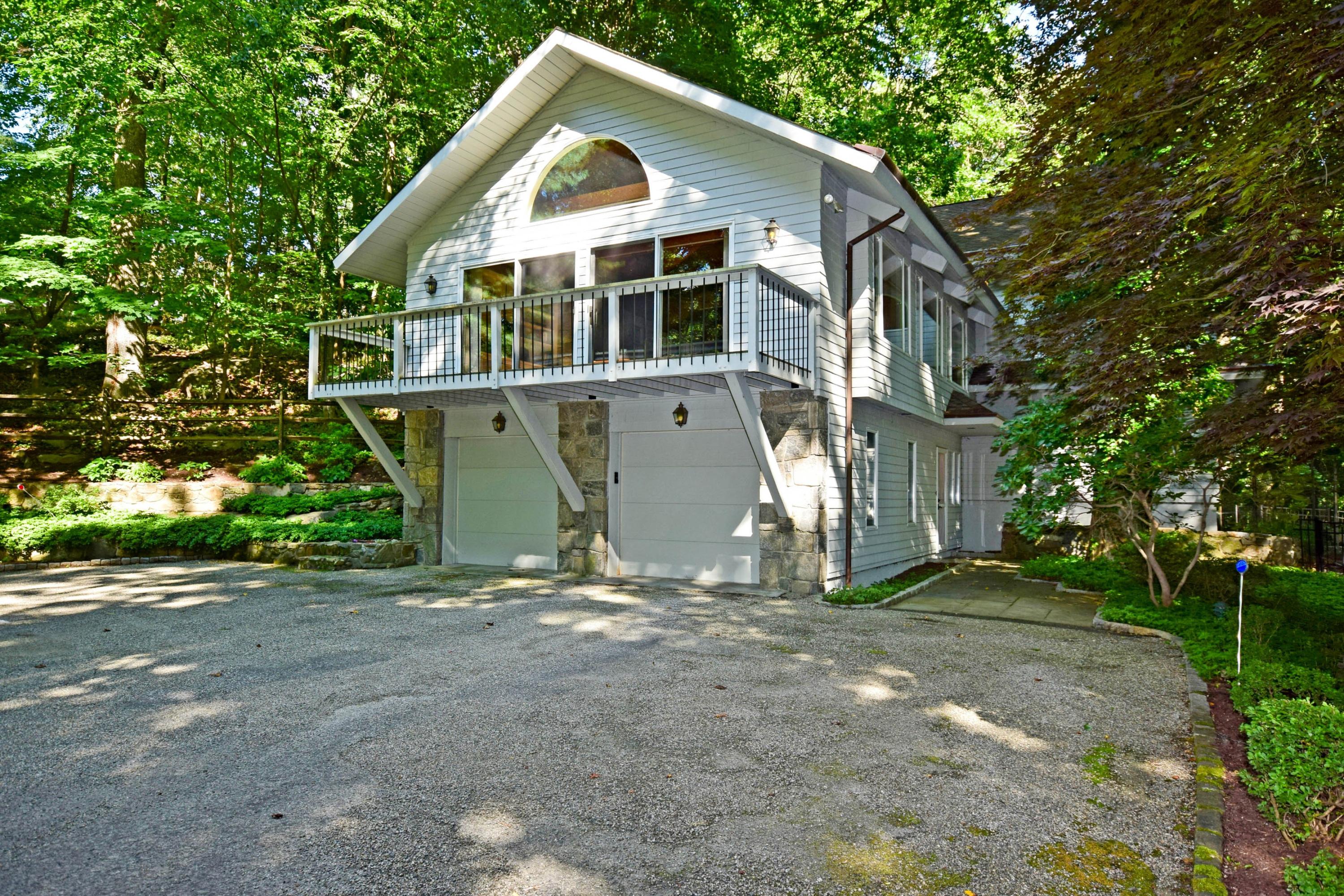 11 Wildcat Road Darien, CT 06820 - Photo 1 of 25 a view of a house with a yard and large tree
