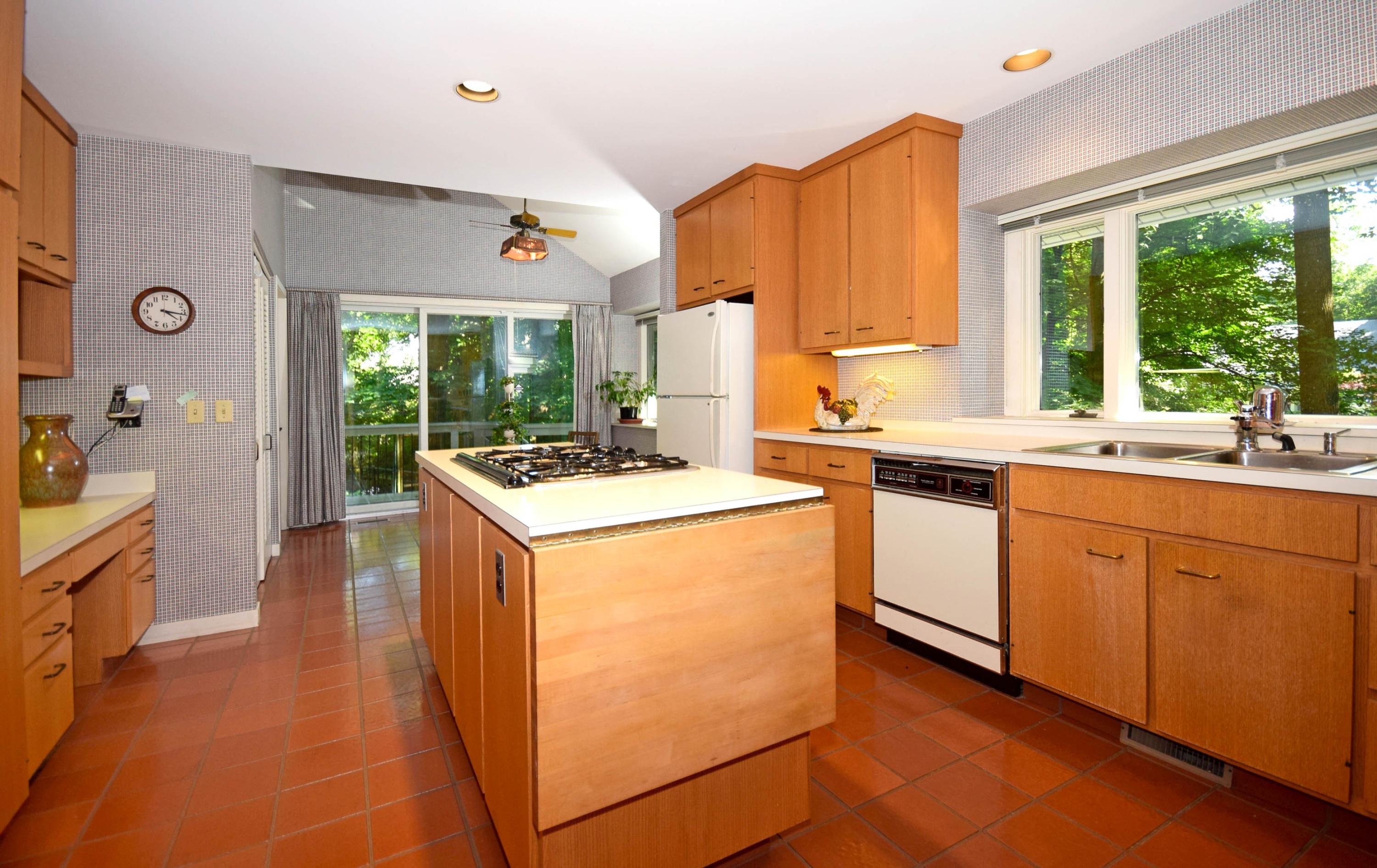 11 Wildcat Road Darien, CT 06820 - Photo 17 of 25 a kitchen with a stove a sink and a refrigerator