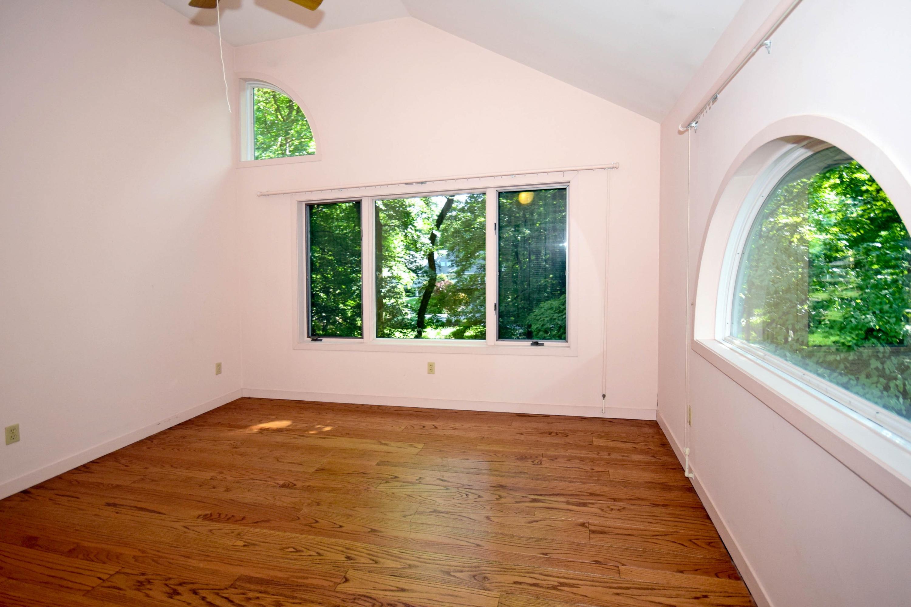 11 Wildcat Road Darien, CT 06820 - Photo 22 of 25 a view of room with window and wooden floor