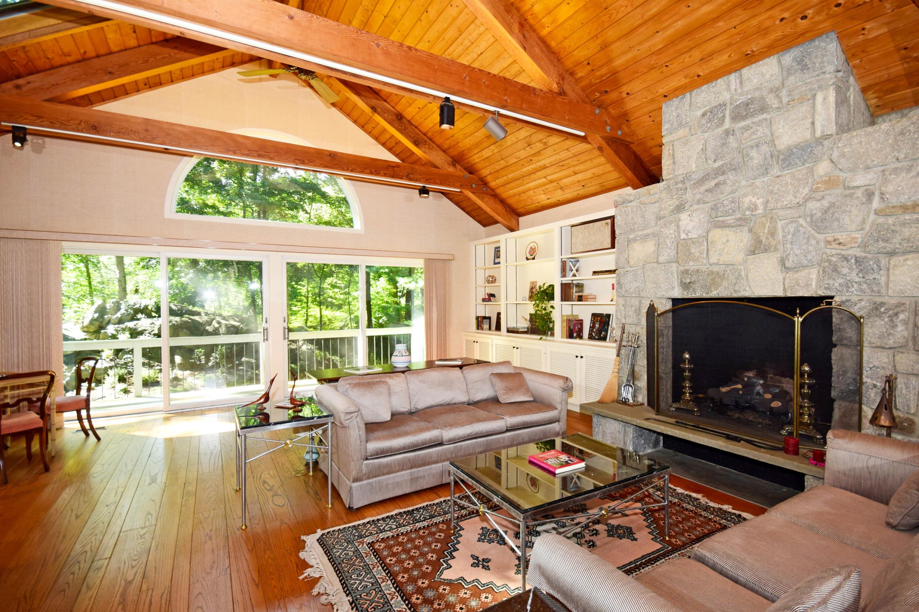 11 Wildcat Road Darien, CT 06820 - Photo 7 of 25 a living room with furniture and a fireplace