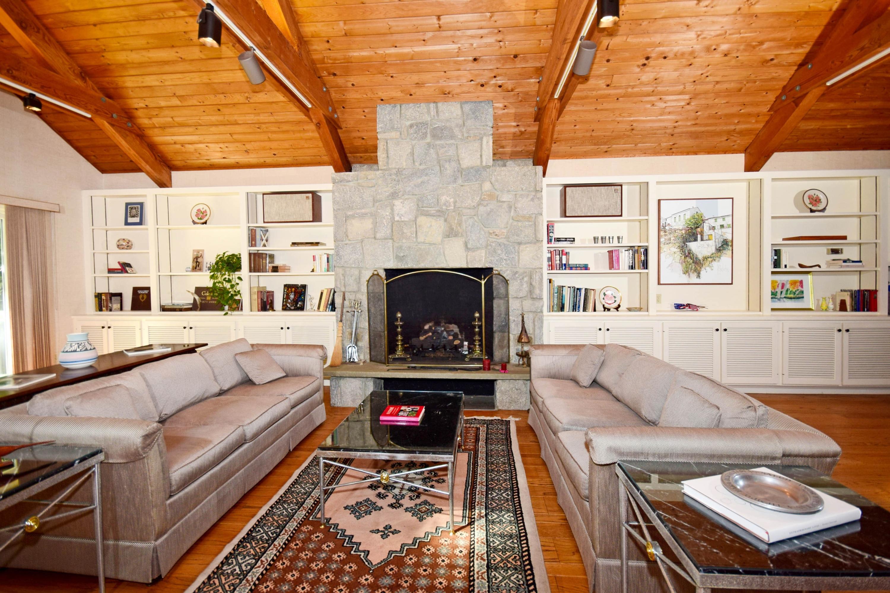 11 Wildcat Road Darien, CT 06820 - Photo 8 of 25 a living room with furniture and a fireplace