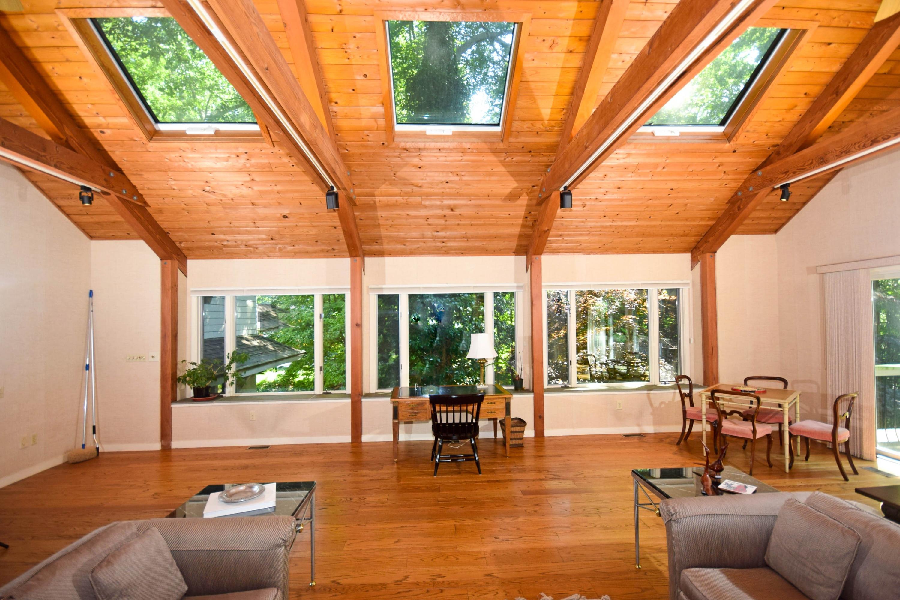 11 Wildcat Road Darien, CT 06820 - Photo 9 of 25 a living room with patio furniture and floor to ceiling windows