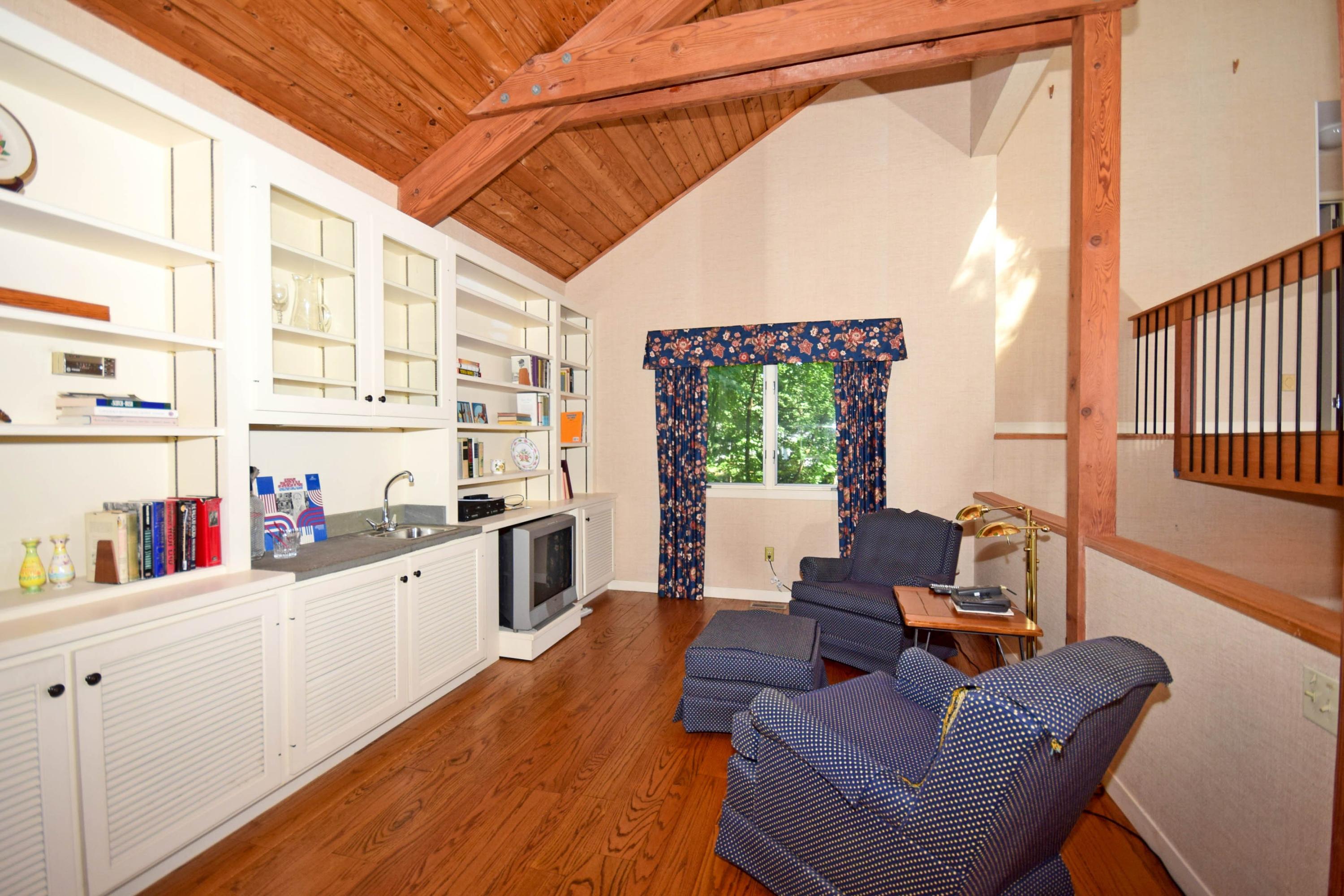 11 Wildcat Road Darien, CT 06820 - Photo 10 of 25 a living room with furniture and a large window
