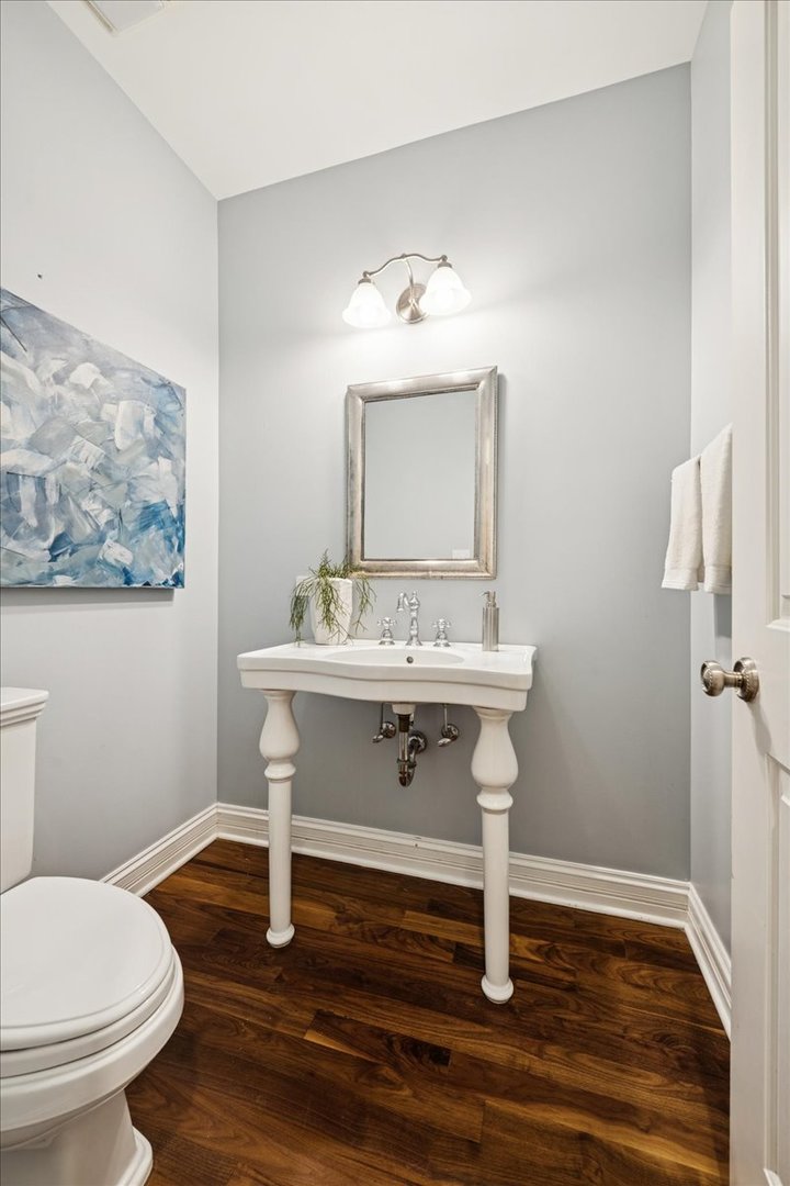 343 Washington Avenue Glencoe, IL 60022 - Photo 14 of 35 a bathroom with a sink a toilet and mirror
