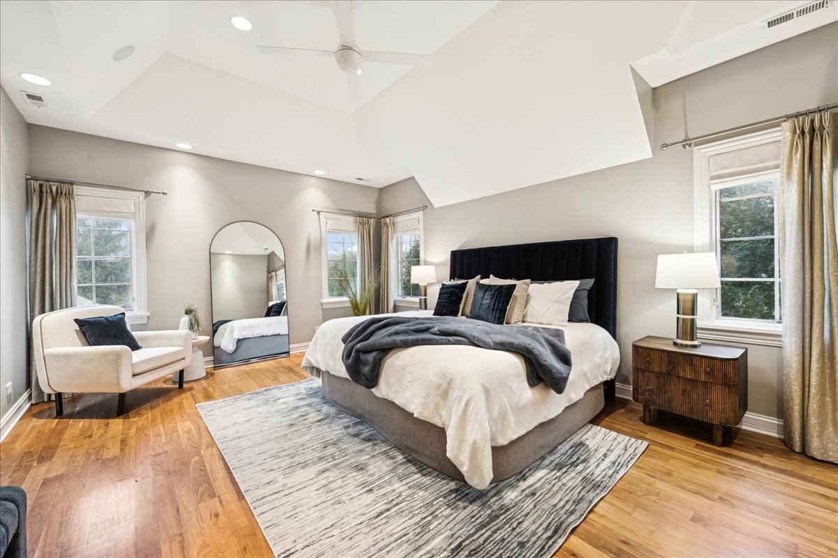 343 Washington Avenue Glencoe, IL 60022 - Photo 17 of 35 a bedroom with a large bed and wooden floor