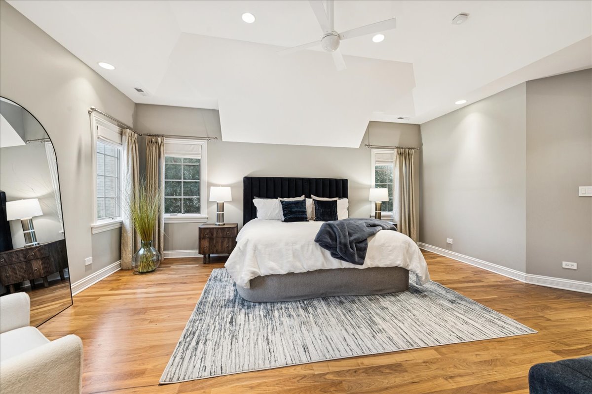 343 Washington Avenue Glencoe, IL 60022 - Photo 18 of 35 a bedroom with a bed and wooden floor