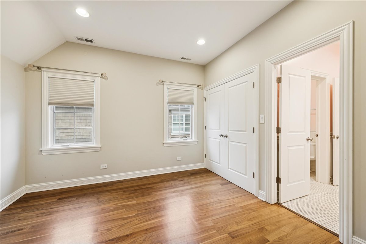 343 Washington Avenue Glencoe, IL 60022 - Photo 23 of 35 an empty room with wooden floor and windows