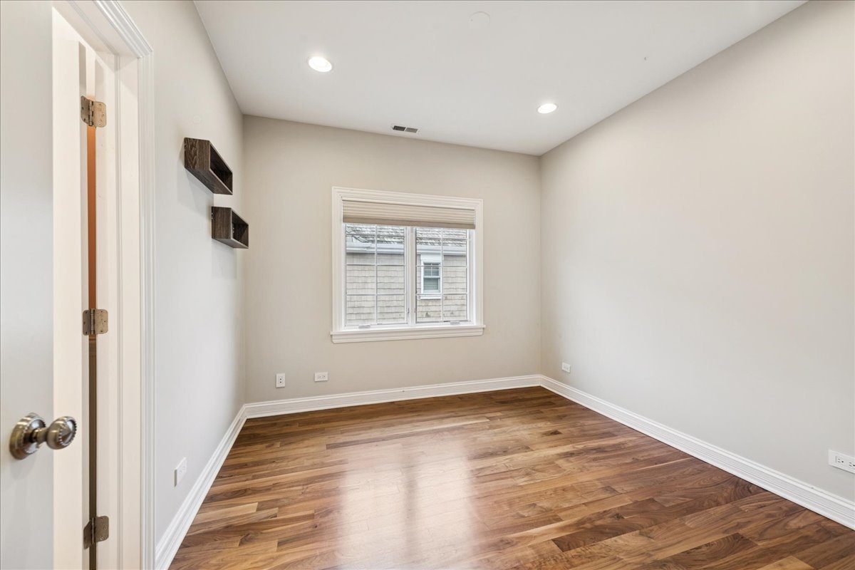 343 Washington Avenue Glencoe, IL 60022 - Photo 24 of 35 a view of a livingroom with wooden floor and a window