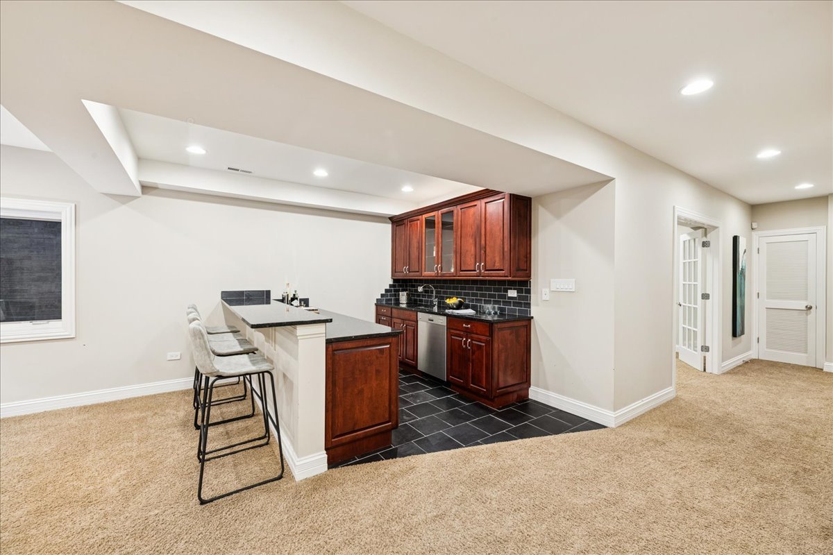 343 Washington Avenue Glencoe, IL 60022 - Photo 29 of 35 a room with furniture a flat screen tv and kitchen view